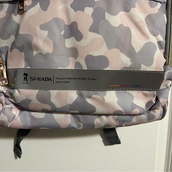 Shiada brand diaper bag backpack with a camouflage pattern in grey, pink, &white - Picture 3 of 15